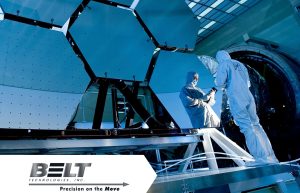 Workers in protective gear in a cleanroom setting